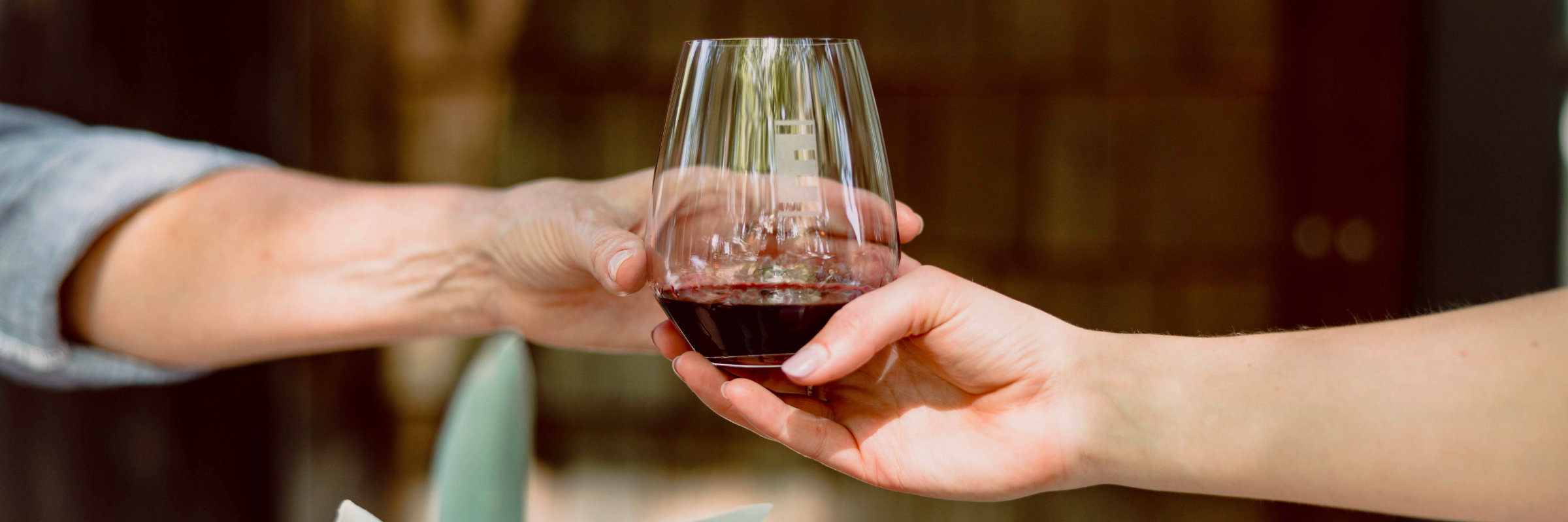 Fess Parker Pinot Noir being poured into a coonskin cap etched glass